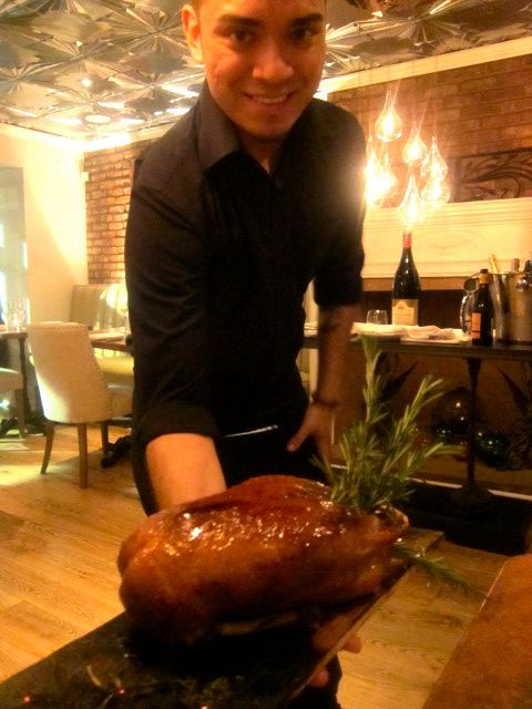 The sweet smell of smoke tantalizes as a waiter gives us a view of the roast duck for two.