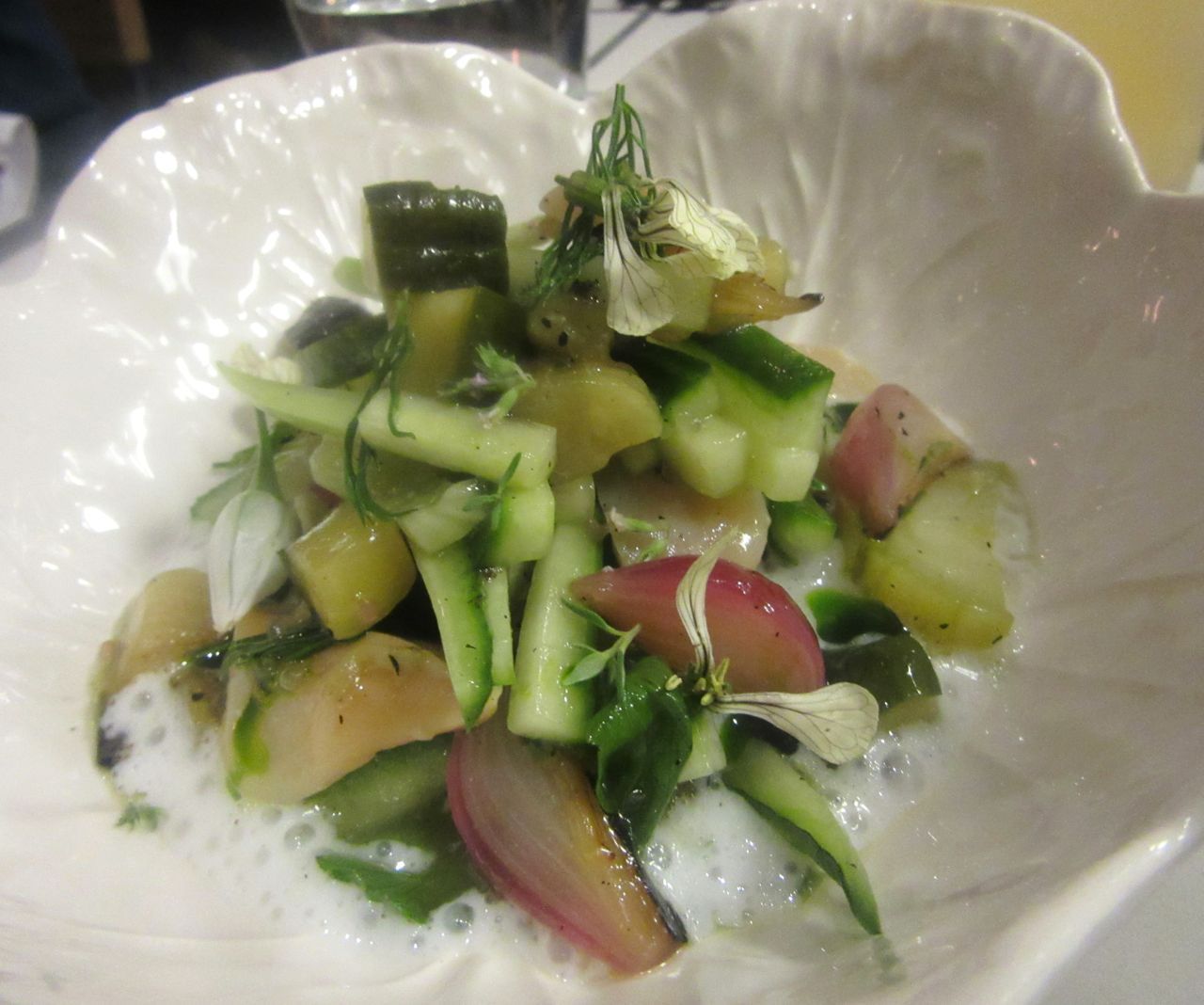 Use the dense Portuguese bread to mop up the charred cucumber and razor clam salad.