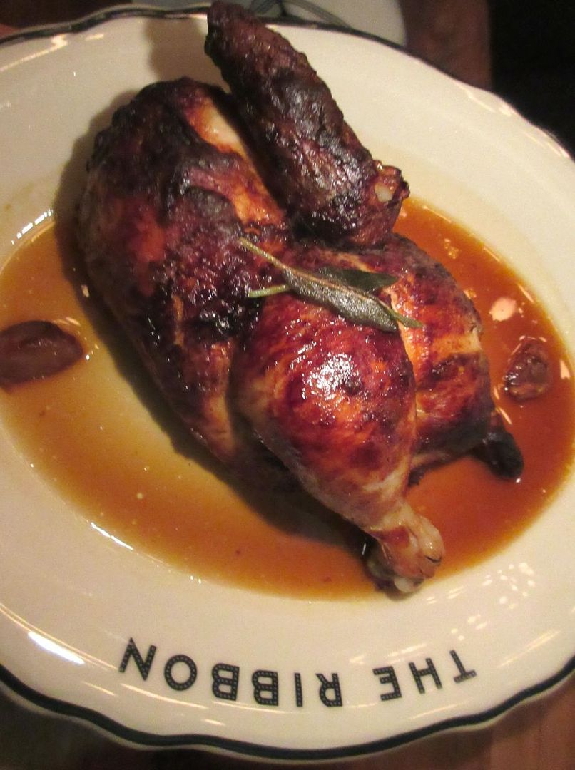 The Spit-Roasted chicken, solo on its oval plate, looks gorgeous but something is missing.