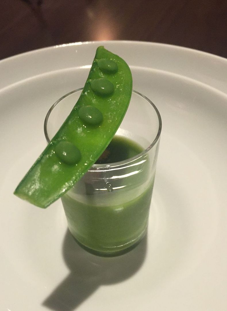 A pea that is more than a mere pea above a gaxpacho with bits of toasted brioche afloat.