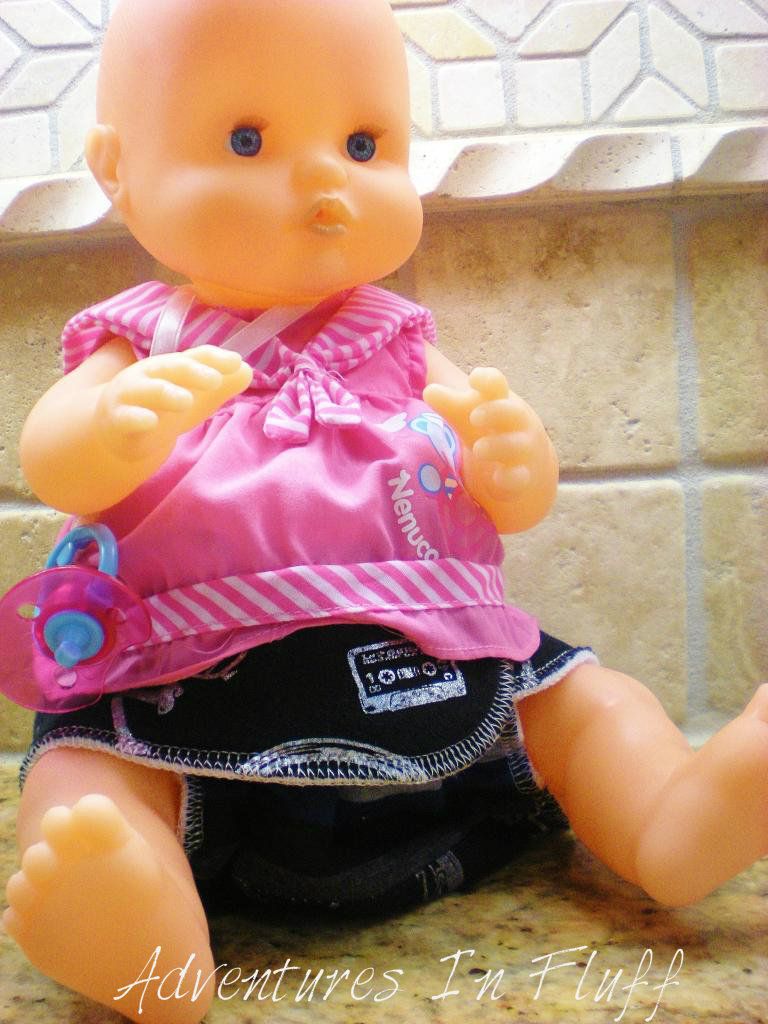 Nenuco Newborn Baby Doll with a cloth diaper on