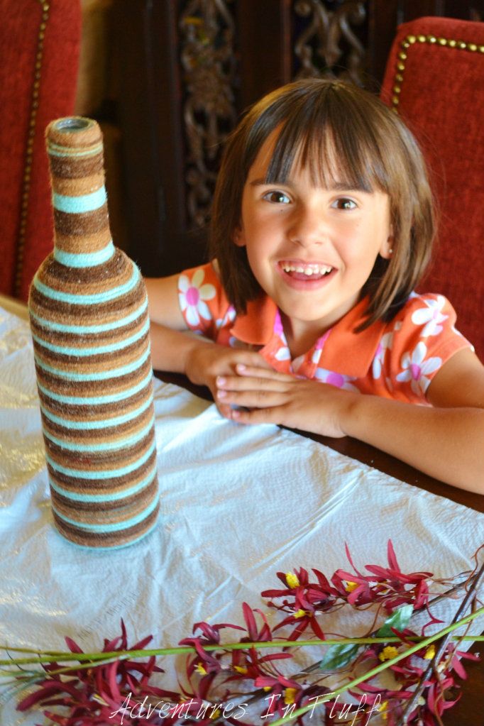 Riley is proud of her yarn wrapped vase project